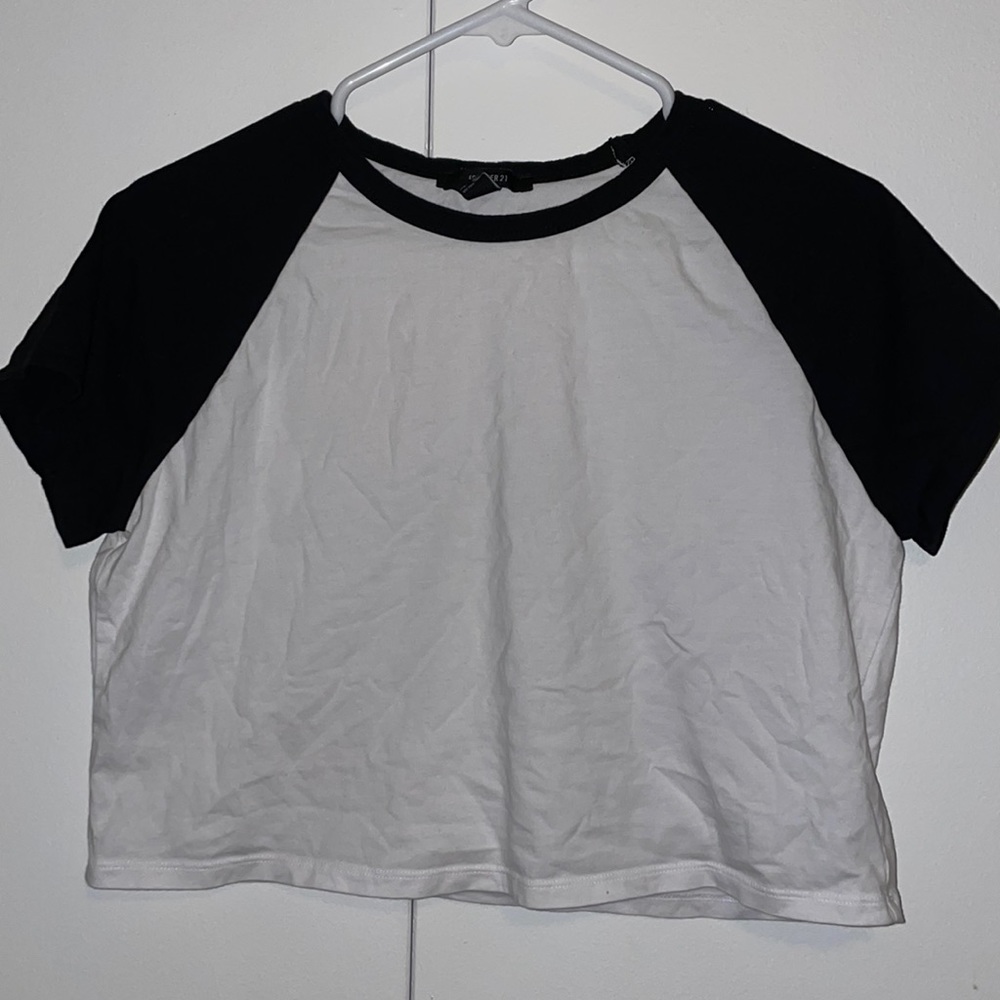 White shirt with black sleeves, cropped